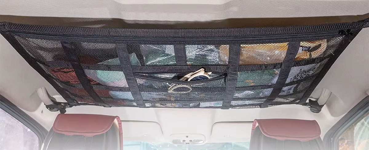 Ceiling storage net installed above the seats, back seat clear